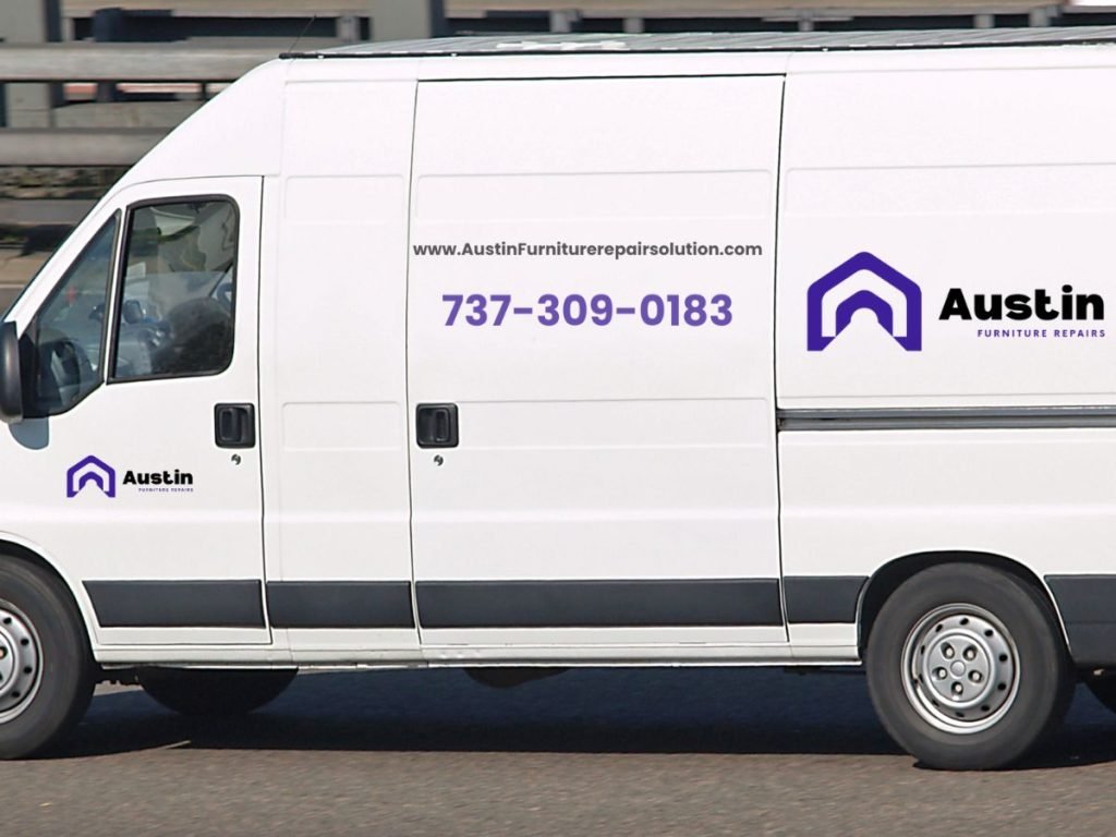 A white van displaying the "Austin Furniture Repairs" logo, website, and contact number on its side.